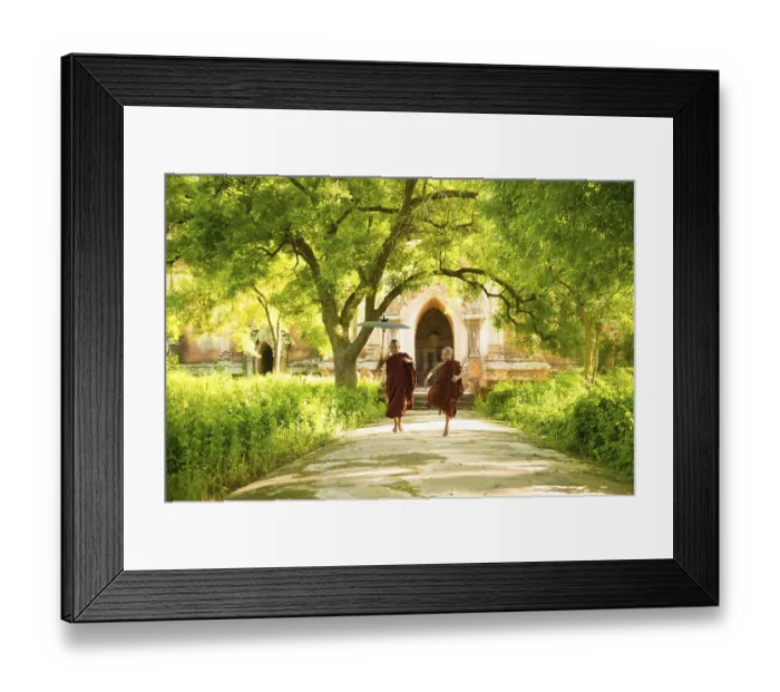 Framed Print : Two little Buddhist novice monks running outdoors under shade of green tree