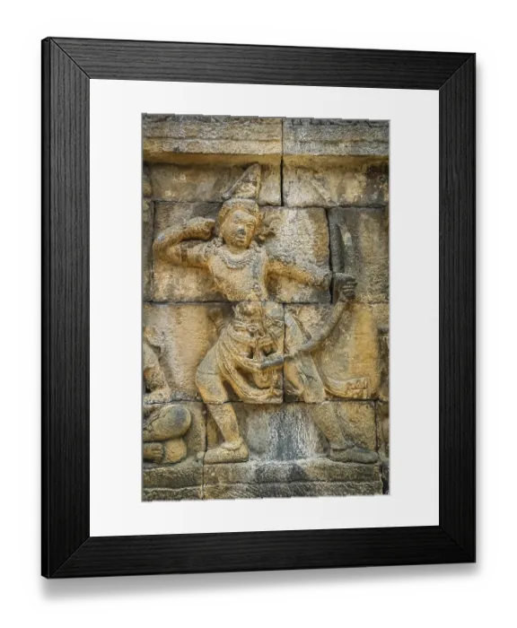 Framed Print : Small figure of a female archer carved on the wall in the Borobudur temple in Java Framed Print : Small figure of a female archer carved on the wall in the Borobudur temple in Java
