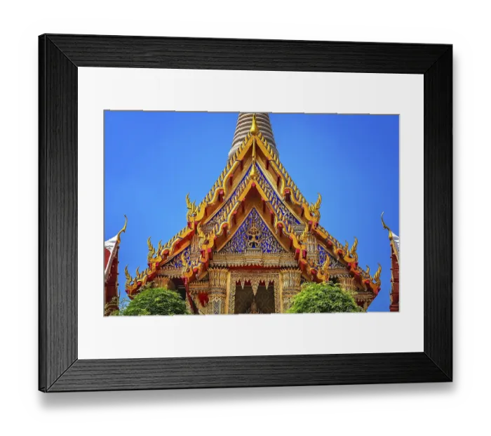 Framed Print : Ornate golden triangular roof of a Buddhist temple in Bangkok