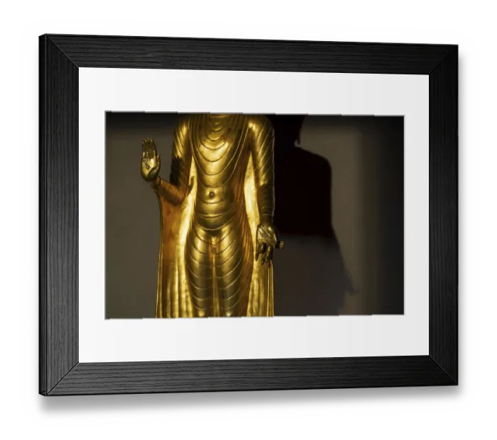 Framed Print : Standing gilded Buddha statue, the right hand (raised)