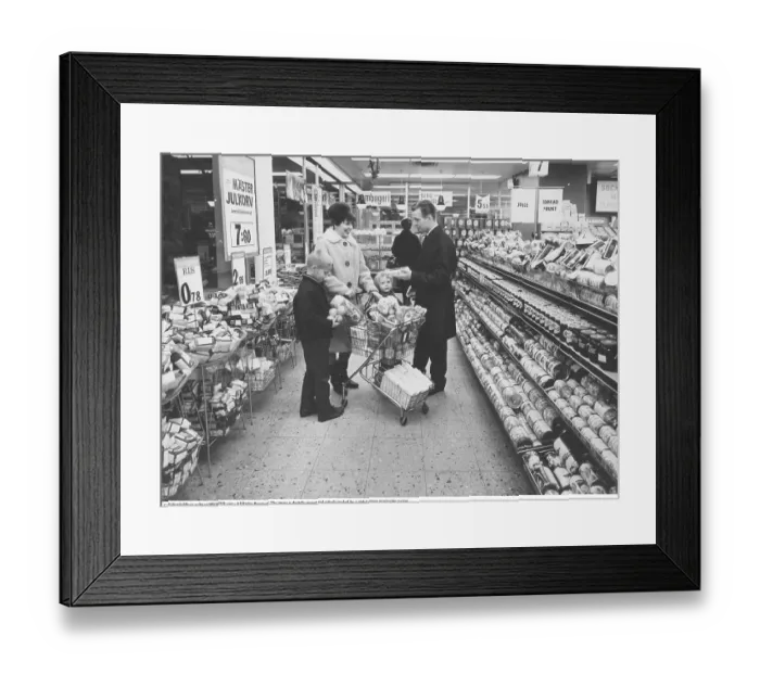 Framed Print : Shopping 1964. Interior of a Co-op shop where a family with children is doing a big shop