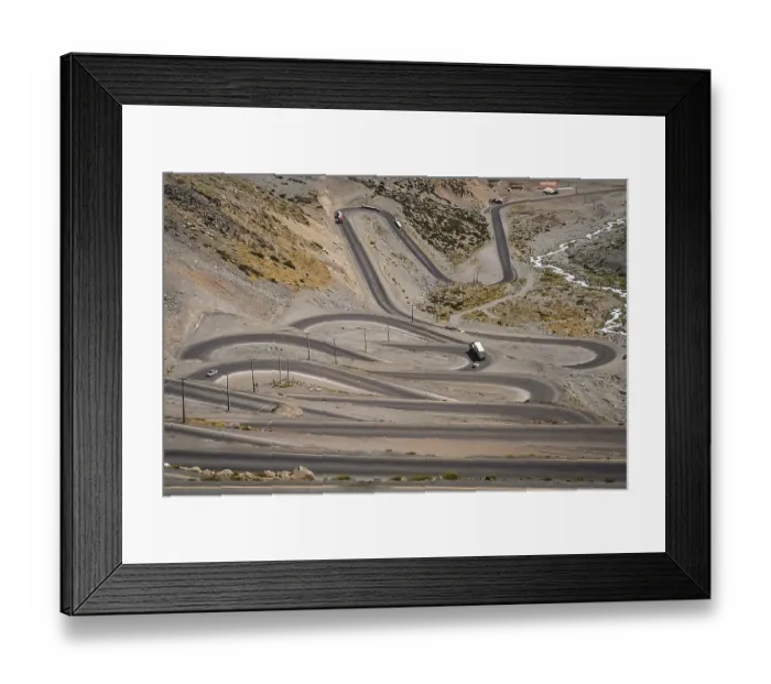 Framed Print : Cars trucks and lorries driving on the twisting and turning switchback road through high Andes in Chile Framed Print : Cars trucks and lorries driving on the twisting and turning switchback road through high Andes in Chile