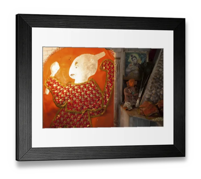 Framed Print : Red dressed god in a Rajasthan tempple