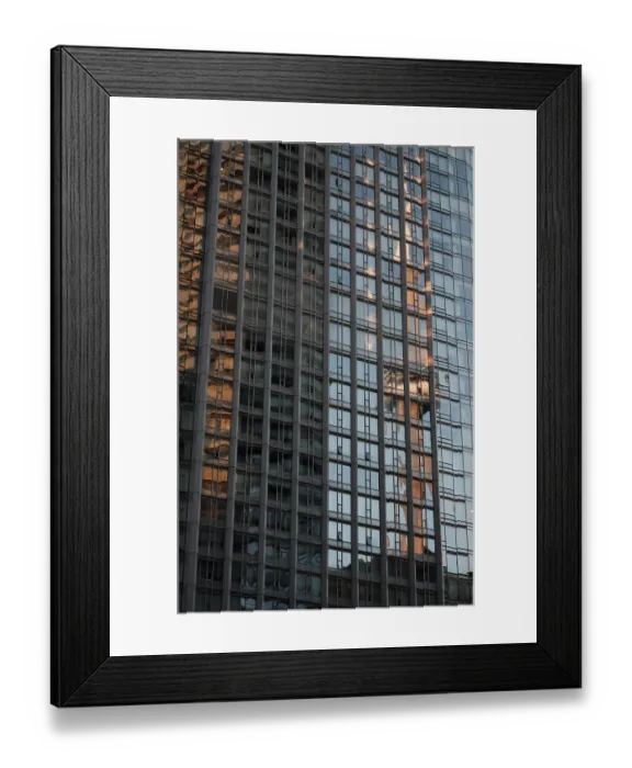 Framed Print : Tall glass building reflecting the CN Tower and a blue sky with a grid pattern in Toronto