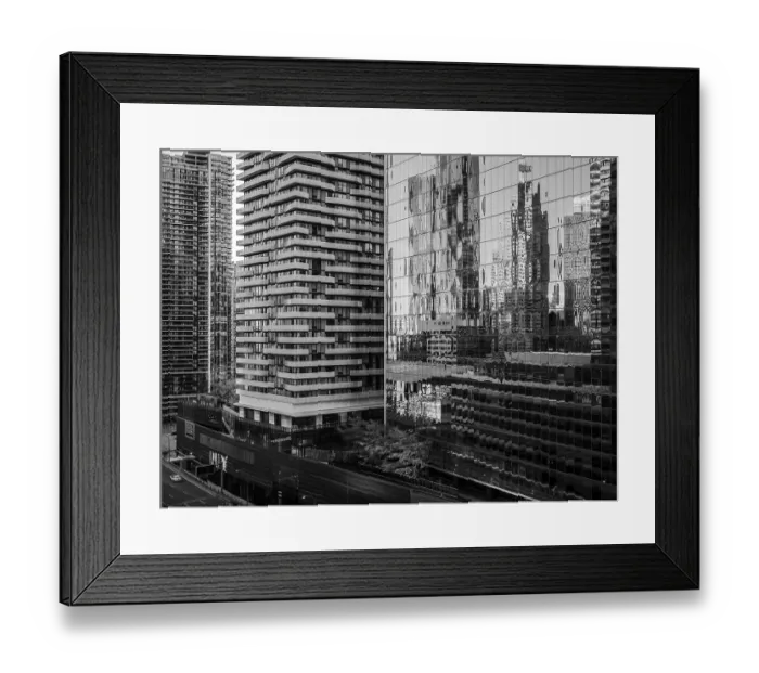 Framed Print : High-rise buildings and distorted reflections on glass in a monochrome setting in Toronto Framed Print : High-rise buildings and distorted reflections on glass in a monochrome setting in Toronto