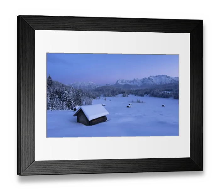 Framed Print : Snowy landscape with huts and forests in front of a mountain panorama in the soft light of the morning at Geroldsee Framed Print : Snowy landscape with huts and forests in front of a mountain panorama in the soft light of the morning at Geroldsee