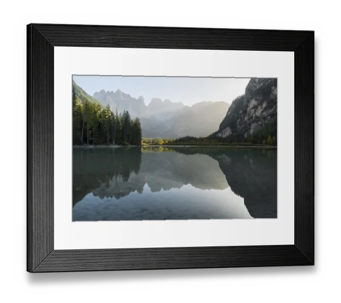 Framed Print : A quiet lake (Toblach lake) reflects the surrounding mountains in the soft evening light