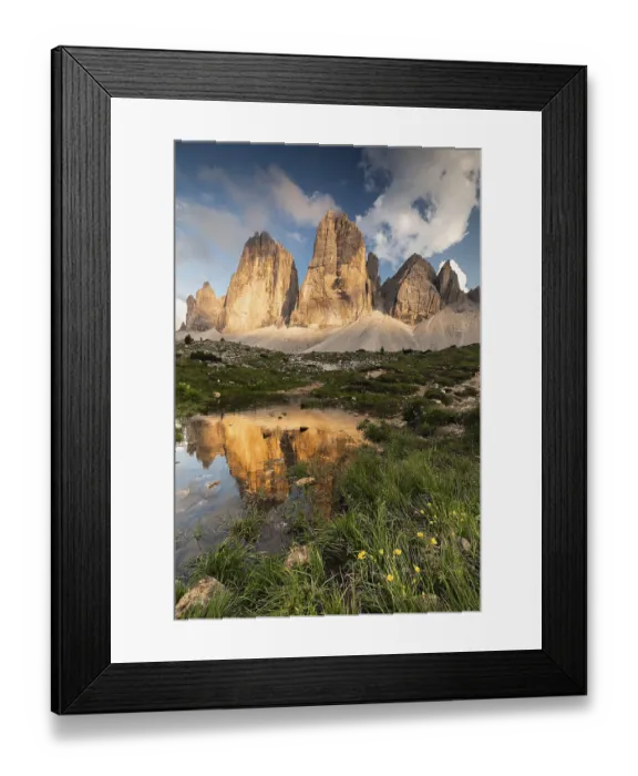 Framed Print : Dramatic Three Peaks rocks in the evening light are reflected in a small pond with wild flowers Framed Print : Dramatic Three Peaks rocks in the evening light are reflected in a small pond with wild flowers