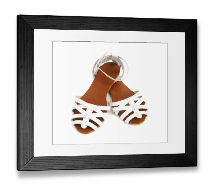 Framed Print : Pair of white leather female sandals isolated on the white background