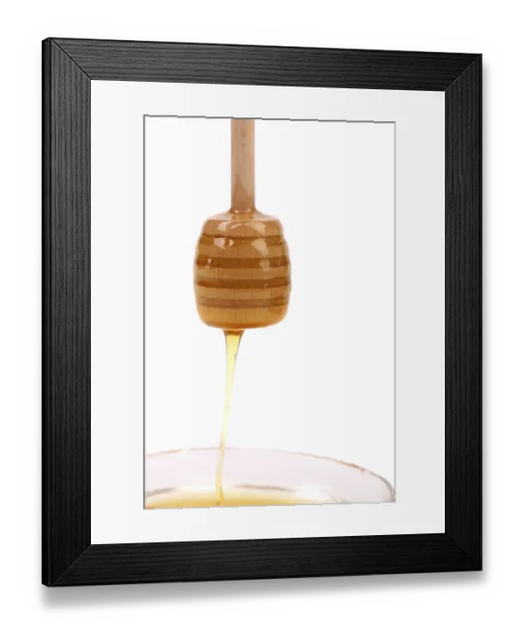 Framed Print : Honey dripping from wooden stick isolated on white background Framed Print : Honey dripping from wooden stick isolated on white background