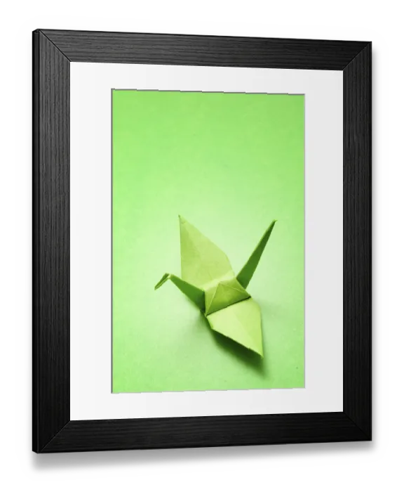 Framed Print : Green origami crane on a matching green background