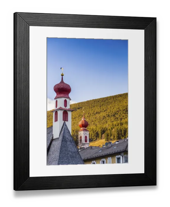 Framed Print : Red bell towers of the church of a mountain village in Italy Framed Print : Red bell towers of the church of a mountain village in Italy