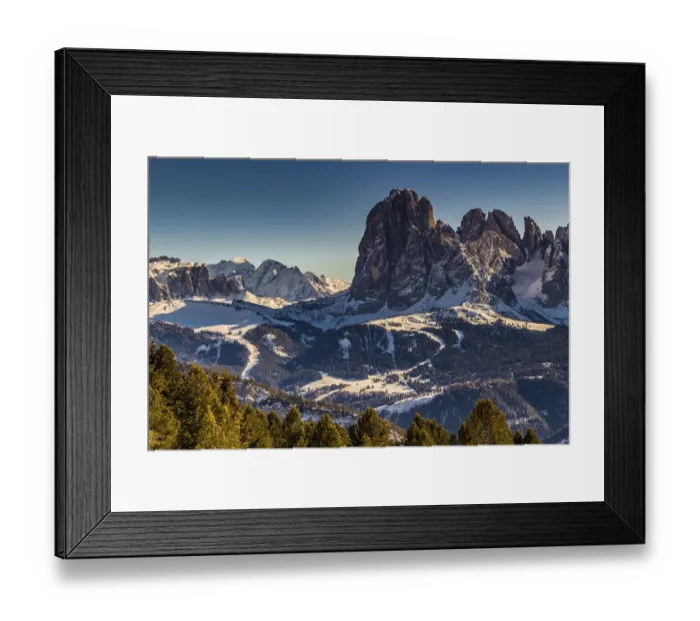 Framed Print : Panorama of the Dolomites with snow-capped peaks and conifers