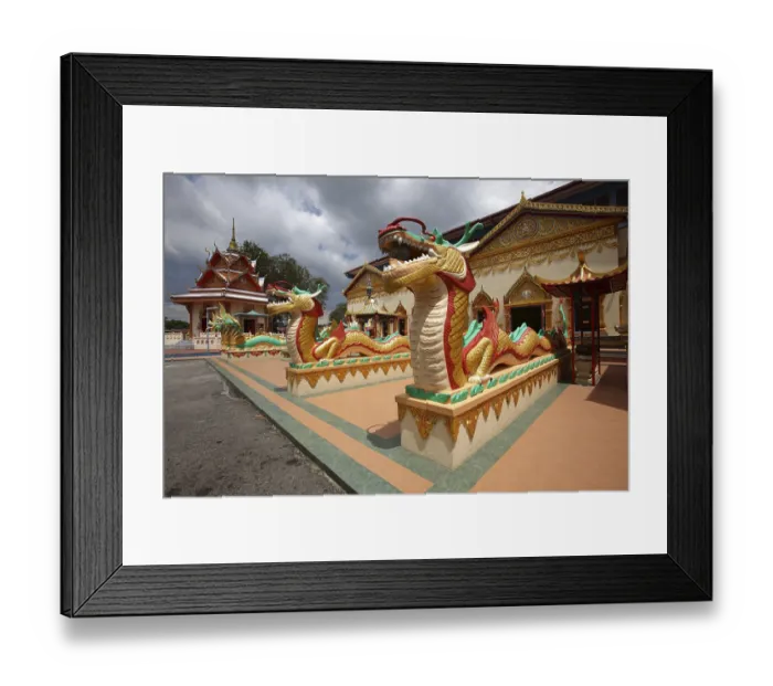 Framed Print : Guarding snakes at Wat Chayamangkalaram temple
