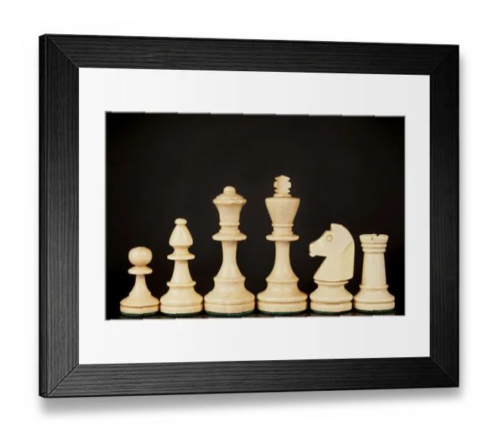 Framed Print : A set of wooden chess pieces including a king Framed Print : A set of wooden chess pieces including a king