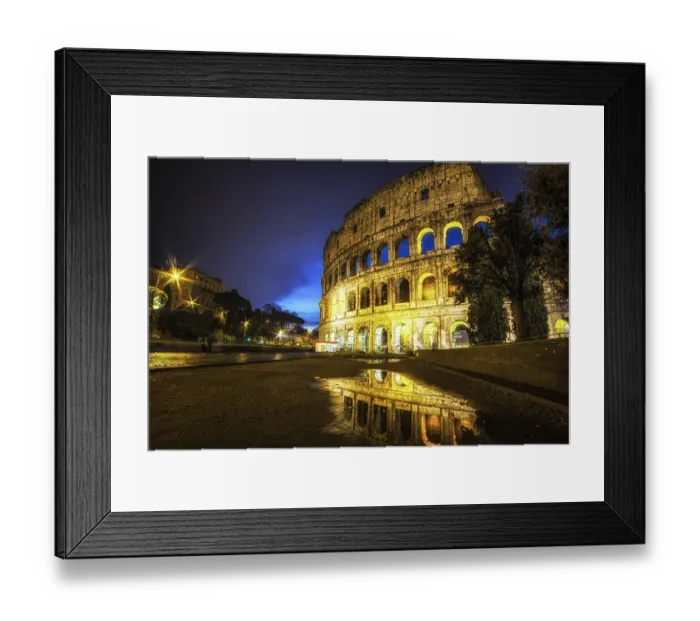 Framed Print : Famous Colosseum reflecting off the small rain puddle on mud