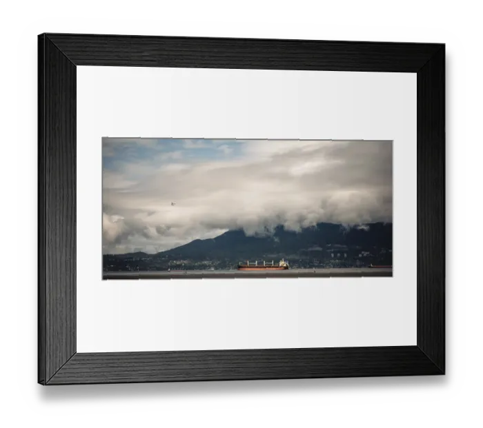 Framed Print : Cloudy sky over mountains with cargo ships on the ocean Framed Print : Cloudy sky over mountains with cargo ships on the ocean