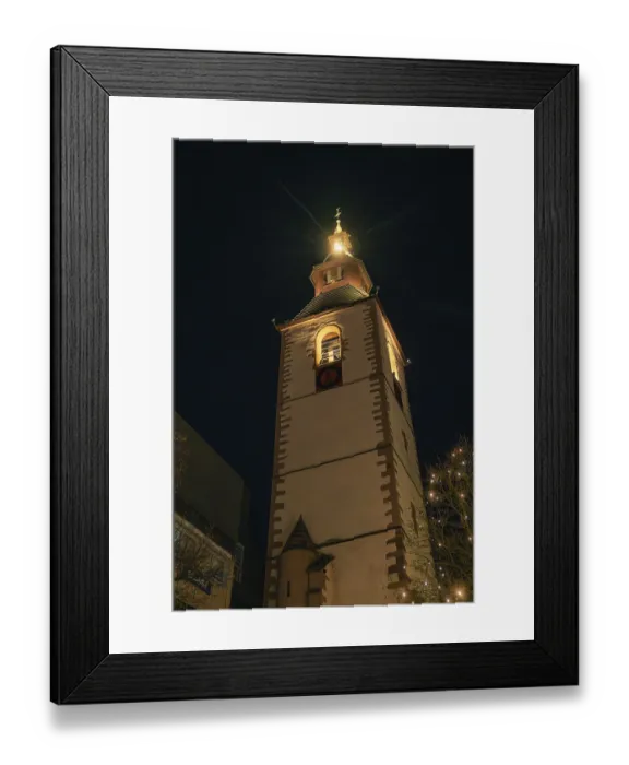 Framed Print : Historic church tower brightly lit at night