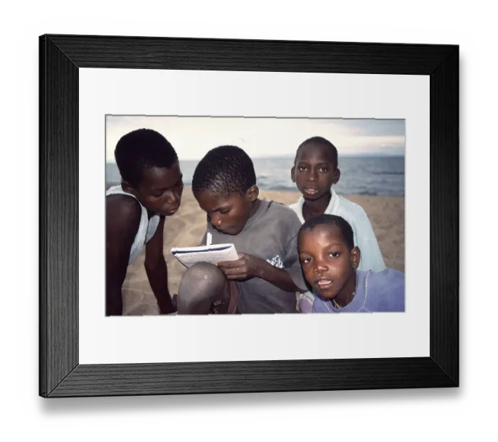Framed Print : Local boys write down their addresses Framed Print : Local boys write down their addresses