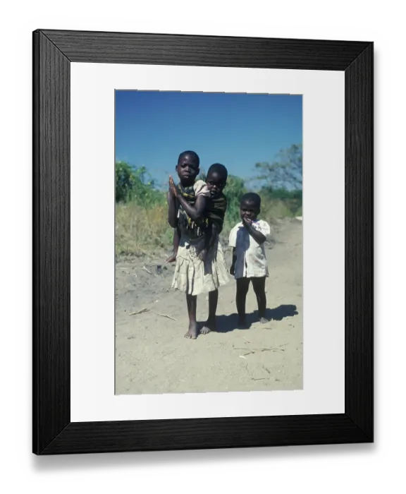 Framed Print : Girl with younger siblings near Kande Beach
