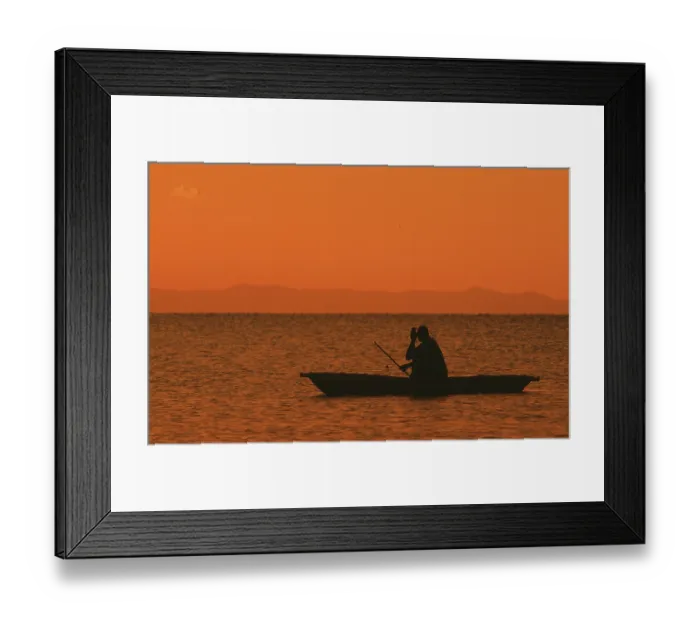 Framed Print : Sunrise over Lake Malawi, man in dugout Framed Print : Sunrise over Lake Malawi, man in dugout