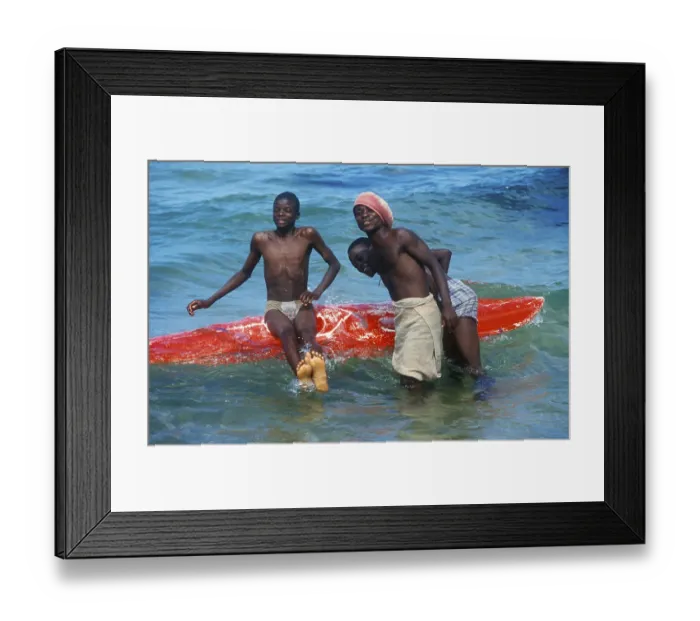 Framed Print : Teenager with surfboard in Lake Malawi Framed Print : Teenager with surfboard in Lake Malawi
