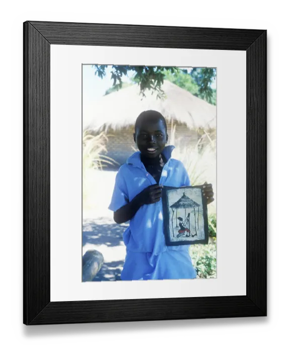 Framed Print : Local boy showing homemade artwork