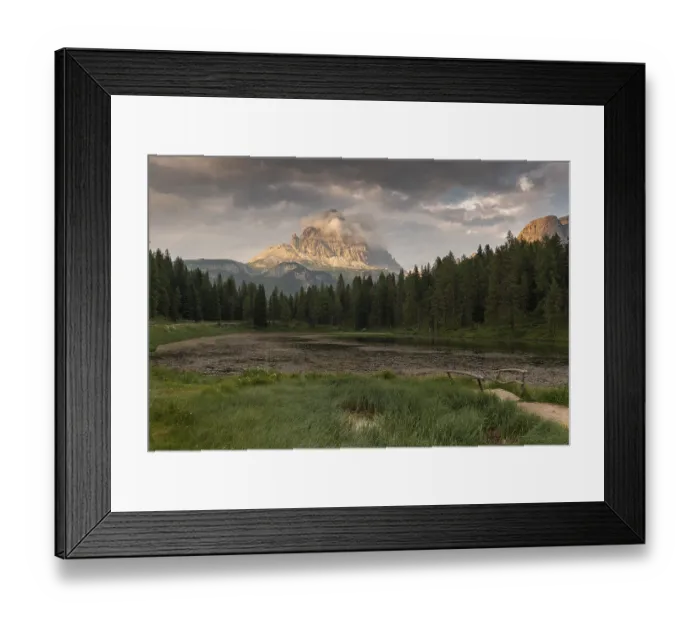 Framed Print : A tranquil scene with a mountain and a forest reflected in a calm lake (Lago Antorno) at sunset with some clouds