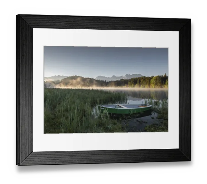 Framed Print : A green boat on the shore of a lake (Geroldsee) shrouded in morning mist
