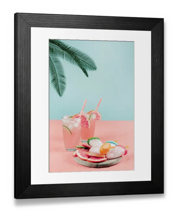 Framed Print : Palm leaves grapefruit cocktail glasses popsicles coral desk against teal background Framed Print : Palm leaves grapefruit cocktail glasses popsicles coral desk against teal background