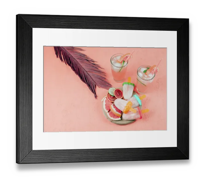 Framed Print : Grapefruits slices juice popsicles with leaf coral textured background