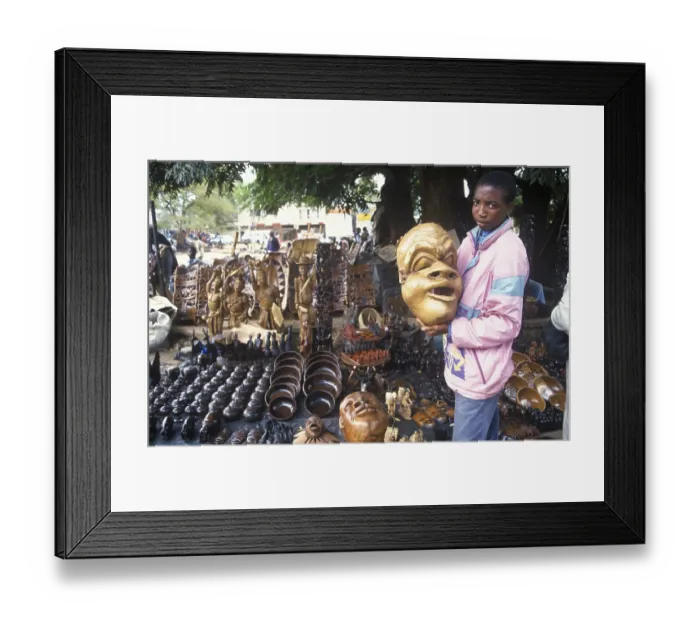 Framed Print : Artist, woodcarving stand at Lilongwe market