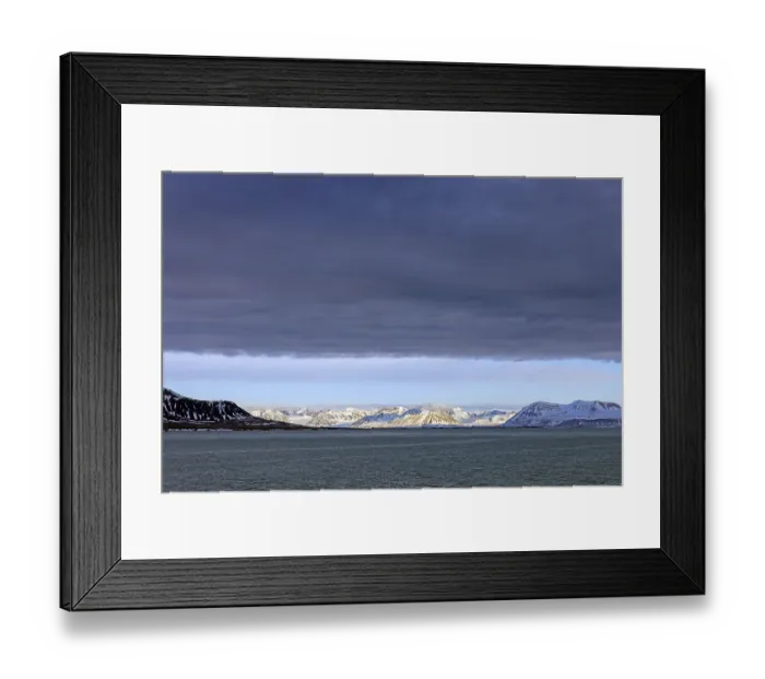 Framed Print : Snow covered mountains and glaciers debouching into Lilliehookfjorden Framed Print : Snow covered mountains and glaciers debouching into Lilliehookfjorden