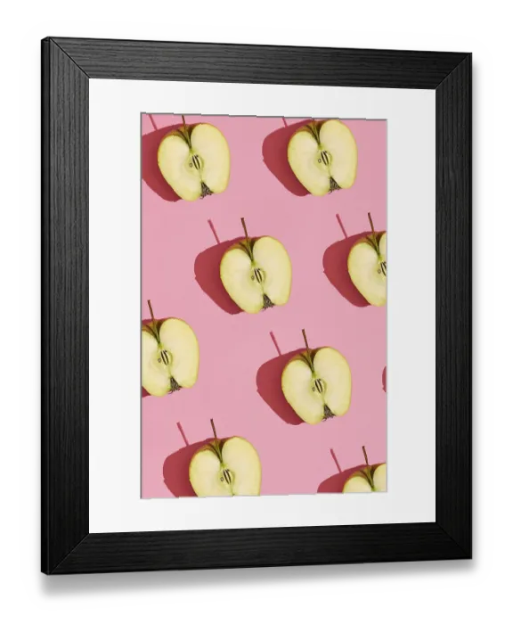 Framed Print : Food design. Top view of colorful fruit pattern of fresh cutted apple halves with pits on coral pink pastel background