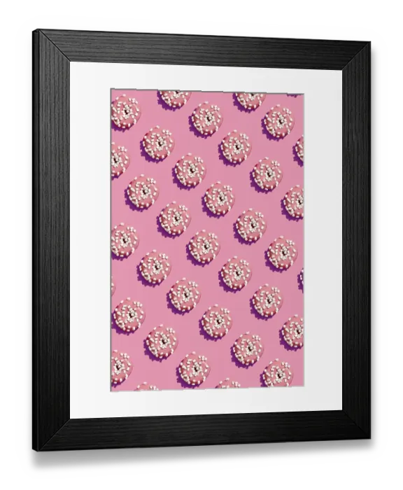 Framed Print : Concept food design with tasty pink glazed donut with white flakes on coral pink pastel background top view pattern