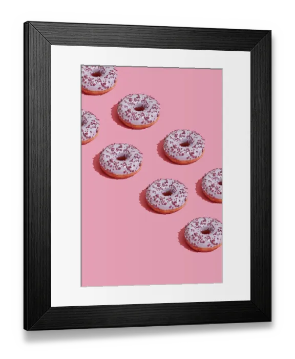 Framed Print : Concept food design with tasty pink glazed donut with red flakes on coral pink pastel background top view pattern
