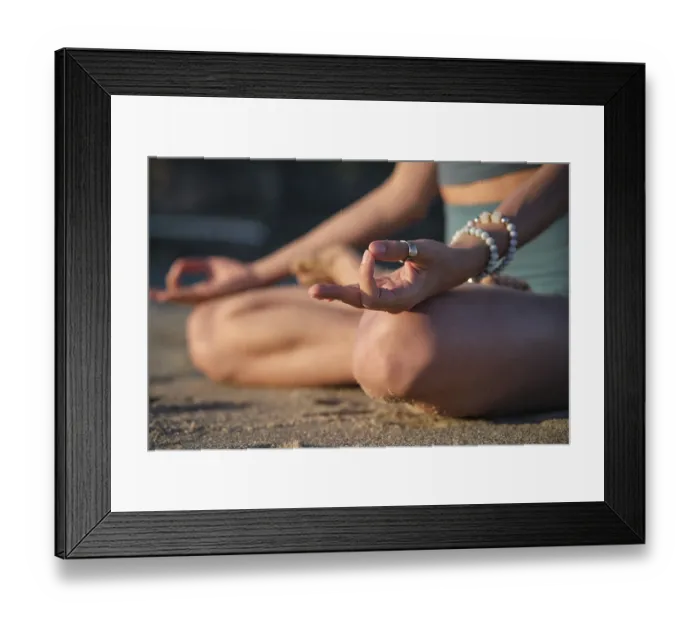 Framed Print : Woman meditates in Padmasana on the beach