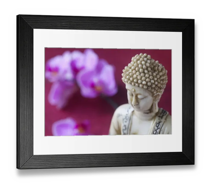 Framed Print : Buddha Figurine With Orchids In The Background