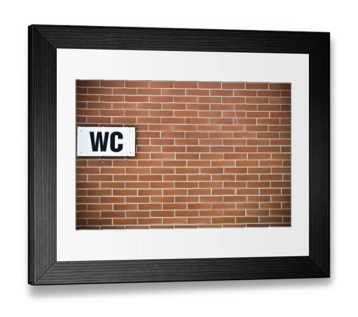 Framed Print : A brick wall with a WC sign mounted on it Framed Print : A brick wall with a WC sign mounted on it