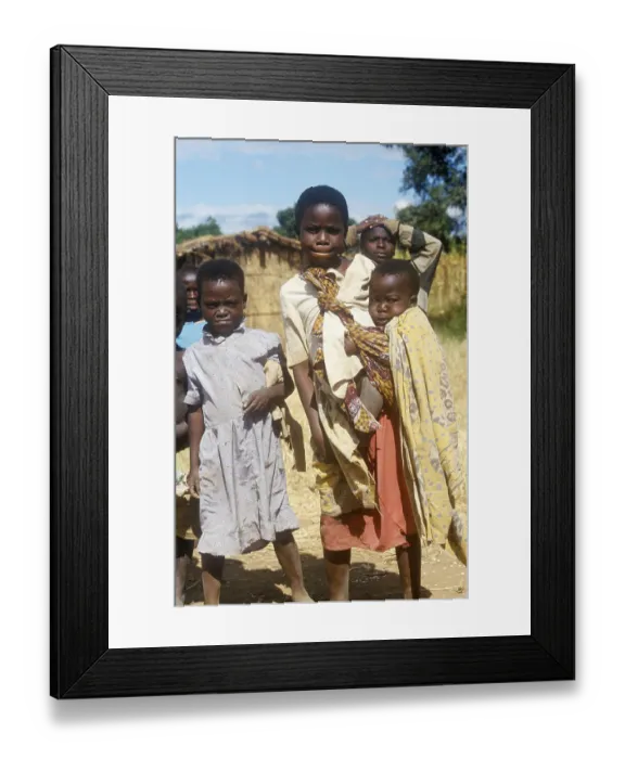 Framed Print : Children posing for the camera on the side of the road