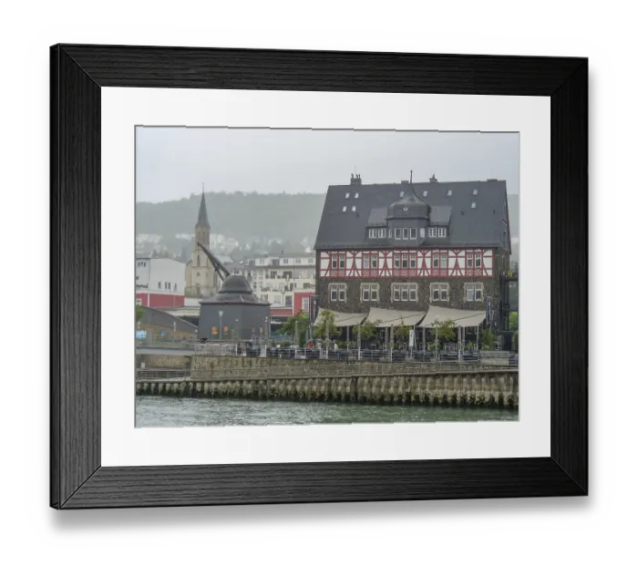 Framed Print : Large half-timbered house with adjacent river and historic city scenery