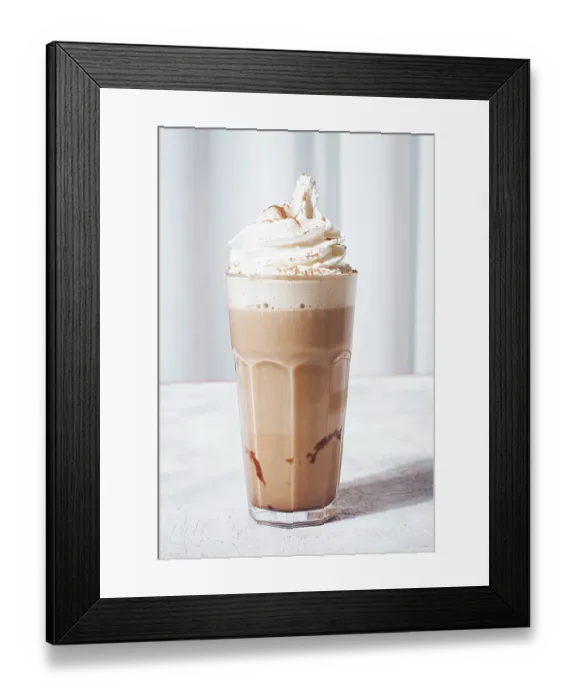 Framed Print : Creamy iced coffee, topped with whipped cream and cinnamon Framed Print : Creamy iced coffee, topped with whipped cream and cinnamon