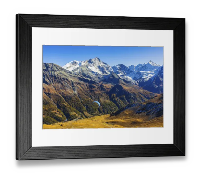 Framed Print : Paragliders flying against the backdrop of the Valais Alps