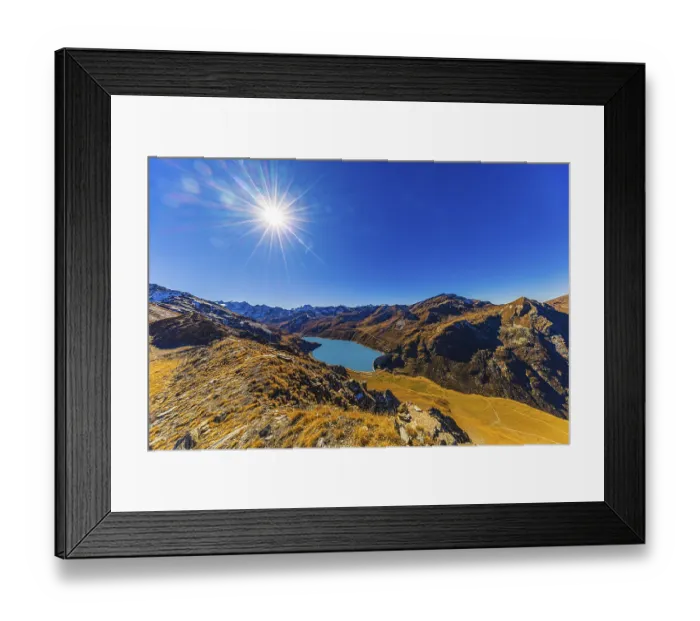 Framed Print : The sun shines over the mountains of the Val d'Anniviers