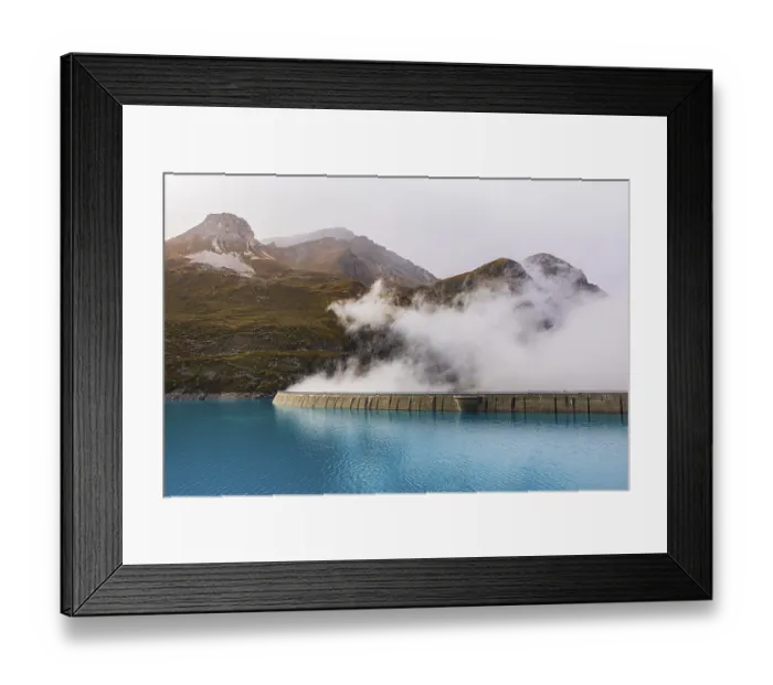 Framed Print : Fog rises over the dam of the Lac de Moiry Reservoir