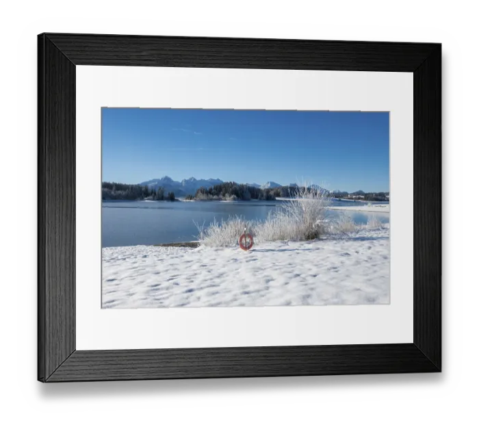 Framed Print : Snow-covered shore with view of snowy mountains through clear sky Framed Print : Snow-covered shore with view of snowy mountains through clear sky
