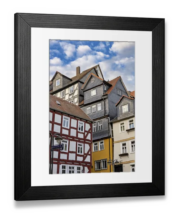 Framed Print : Historic half-timbered houses under a slightly cloudy sky Framed Print : Historic half-timbered houses under a slightly cloudy sky
