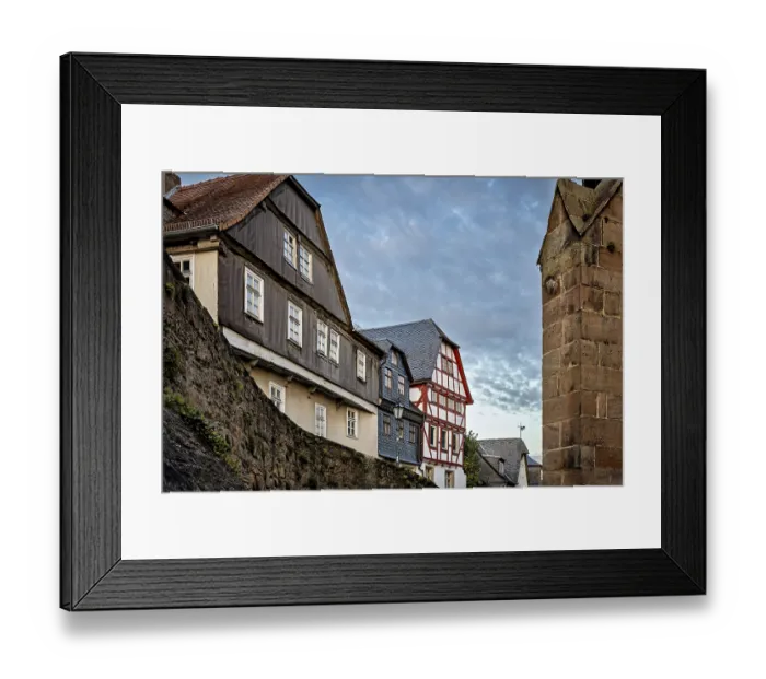 Framed Print : Half-timbered houses and city walls in a cozy evening mood