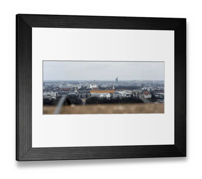 Framed Print : View of a city with diverse architecture and cloudy sky Framed Print : View of a city with diverse architecture and cloudy sky