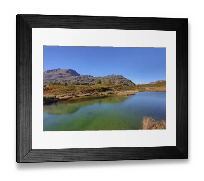 Framed Print : Clear mountain lake landscape in autumn colors under blue sky